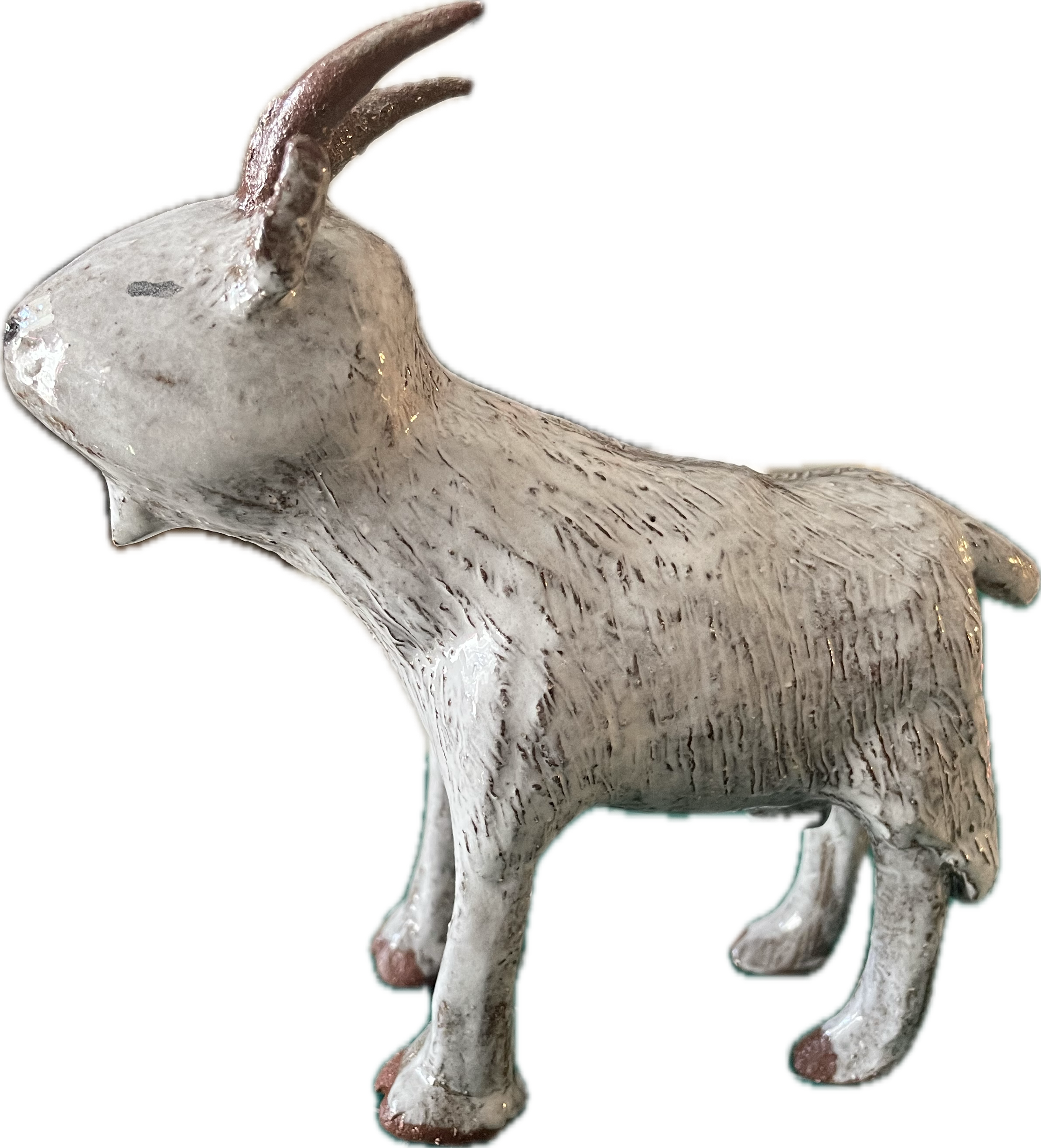 A white ceramic goat
